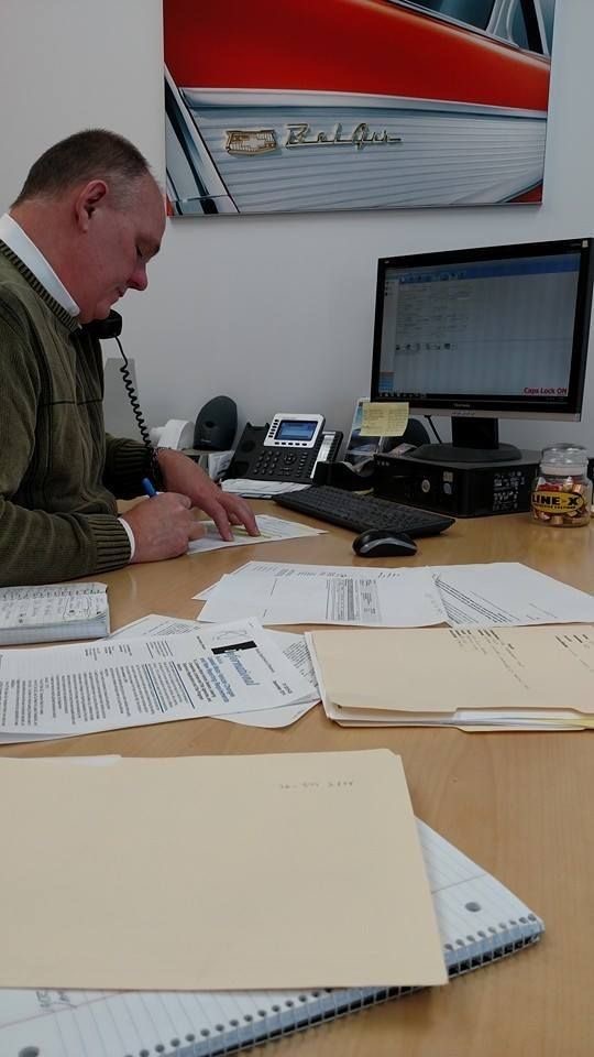 Settlement officer reconciling claim paperwork