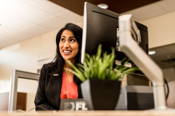 Cashier serving a client at the counter